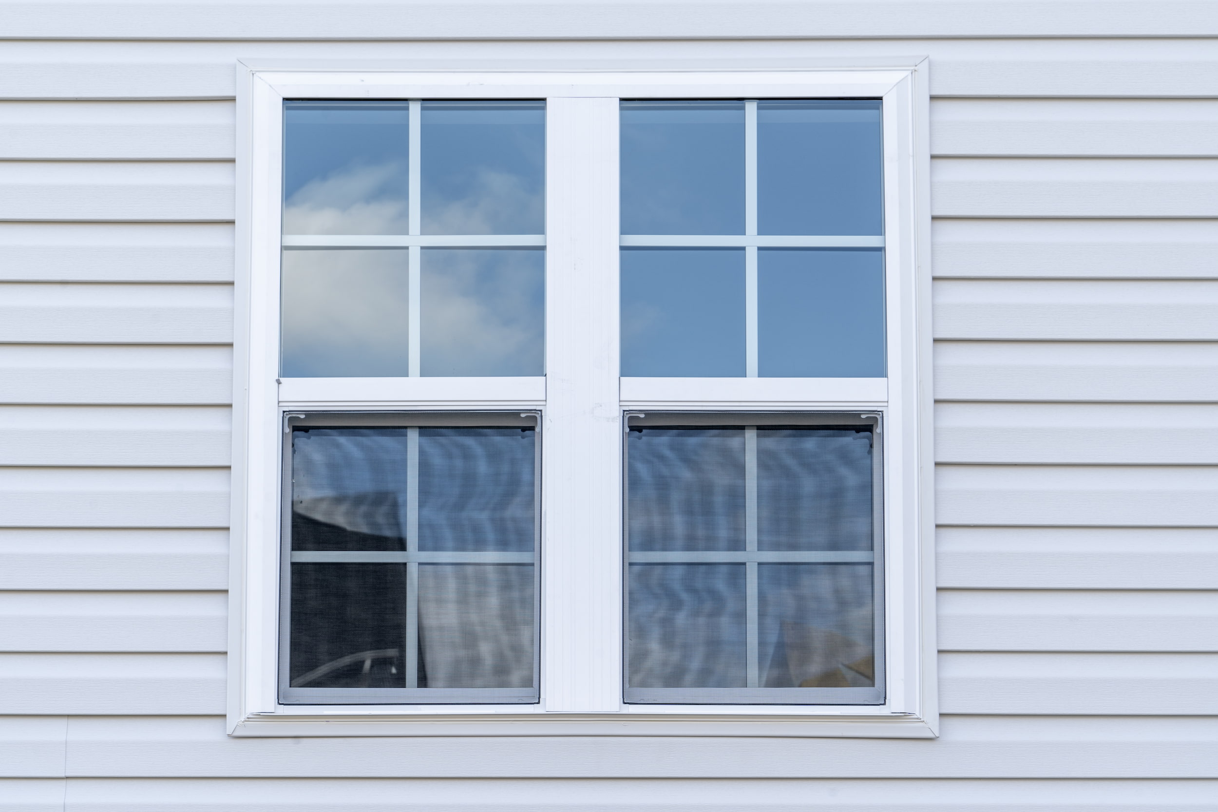 White uPVC sliding sash windows.